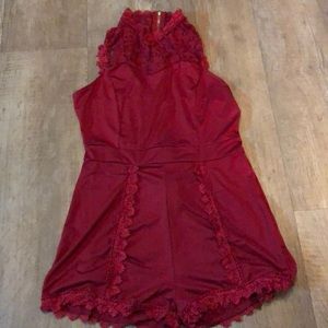 Brand new stylish shekiss romper burgundy color